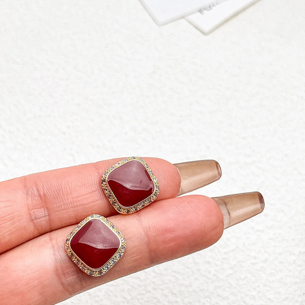 Red square alloy earrings with geometric inlaid design and sweet-cool hybrid style
