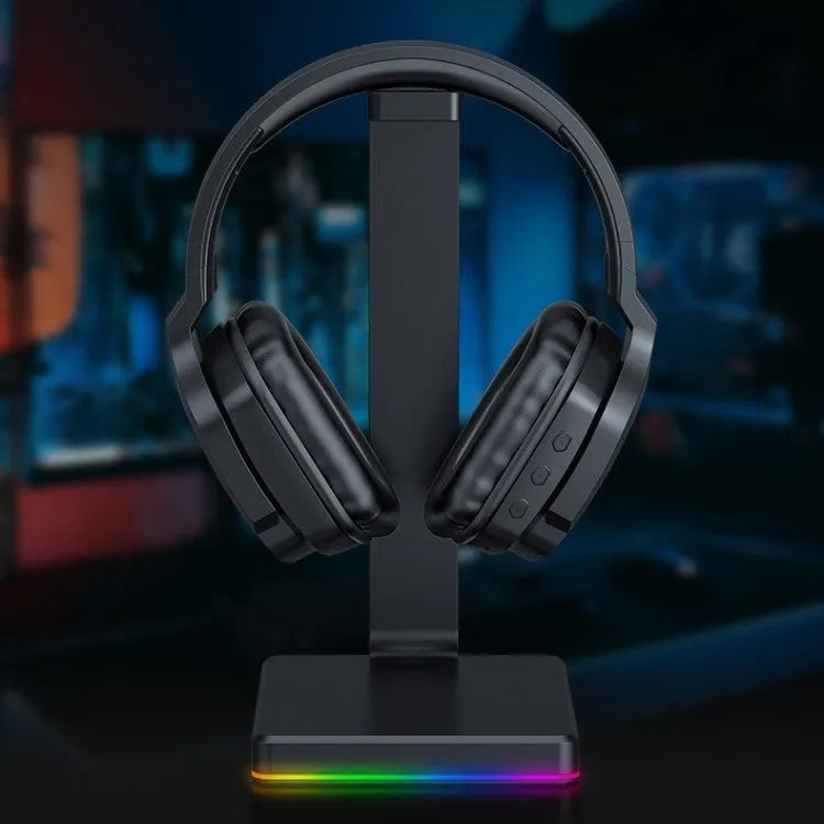 Luminous black wireless gaming headphones with head-mounted design on a dark background