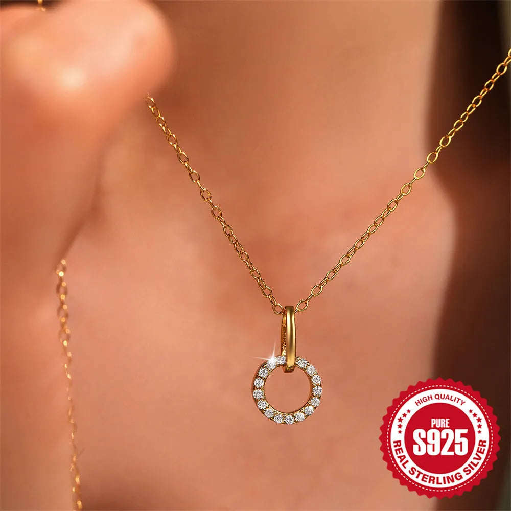 Gold-coloured S925 sterling silver clavicle necklace with a geometric interlocking zircon pendant on an adjustable chain.
