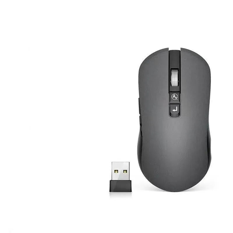 IFLYTEK wireless voice translation gaming mouse with seven buttons on a desk next to a laptop.