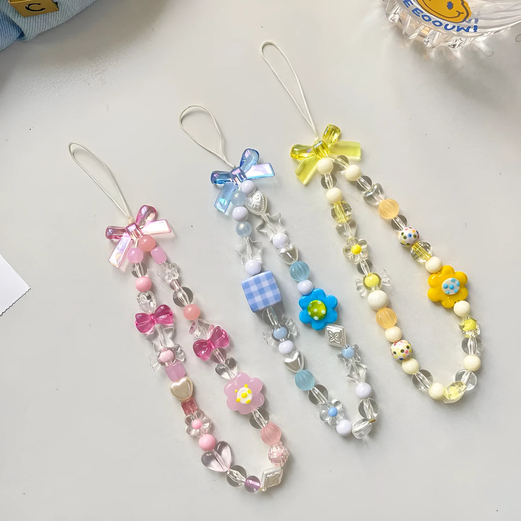 Yellow floral bead mobile phone lanyard with plastic and resin decoration on rope strap