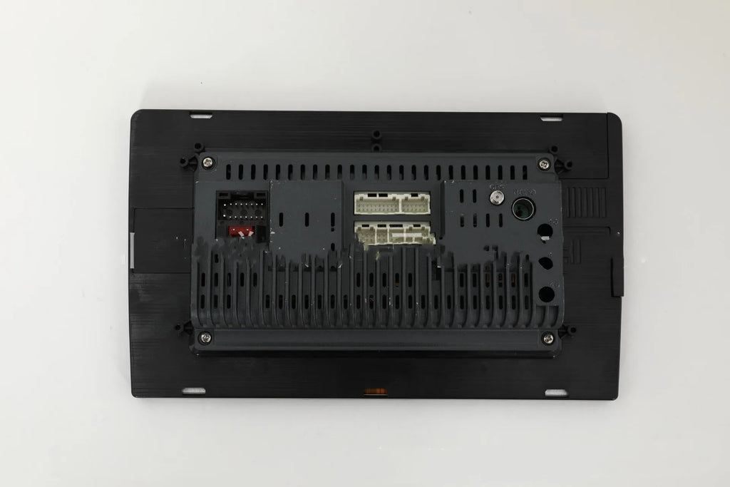 10.1 inch Android universal car machine with trapezoid panel and connection ports visible