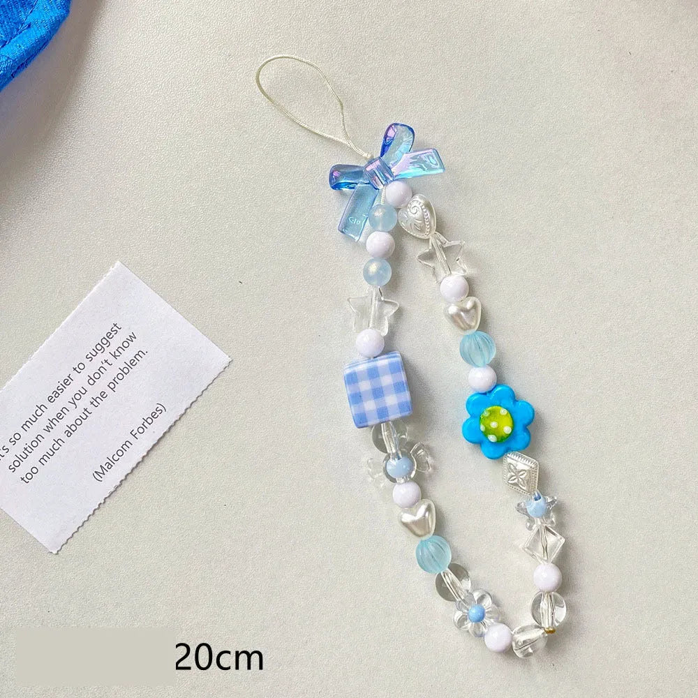 Yellow floral bead mobile phone lanyard with plastic and resin decoration on rope strap