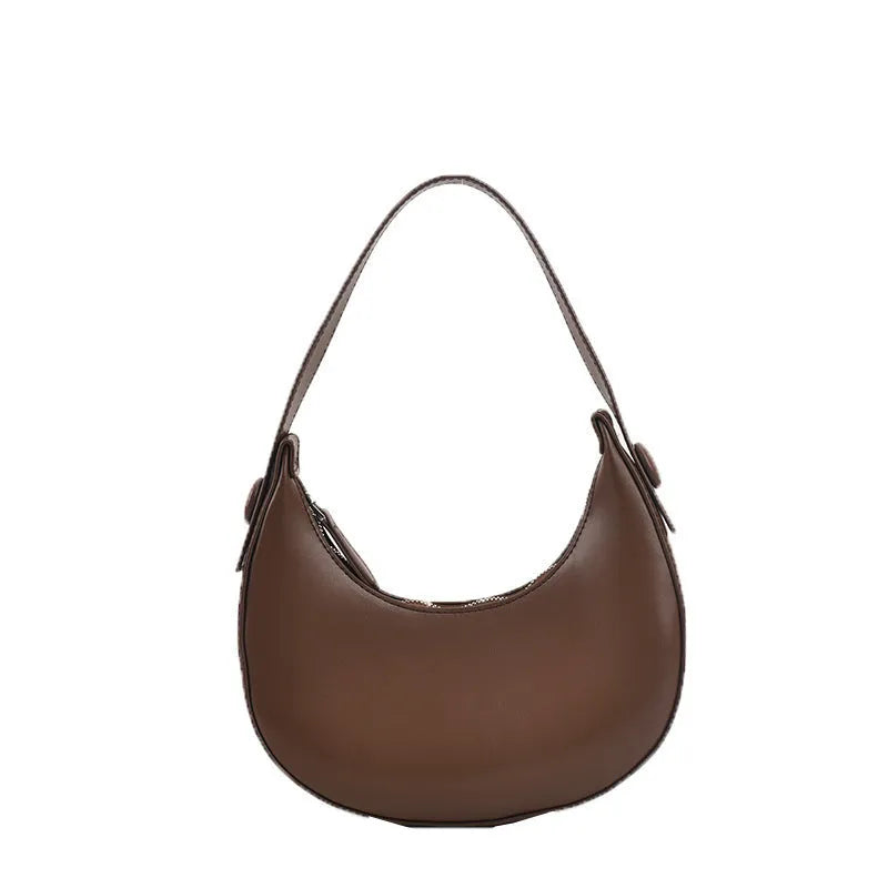 Women's retro-style PU shoulder bag in a dumpling shape, shown in cream yellow colour with a shoulder strap.