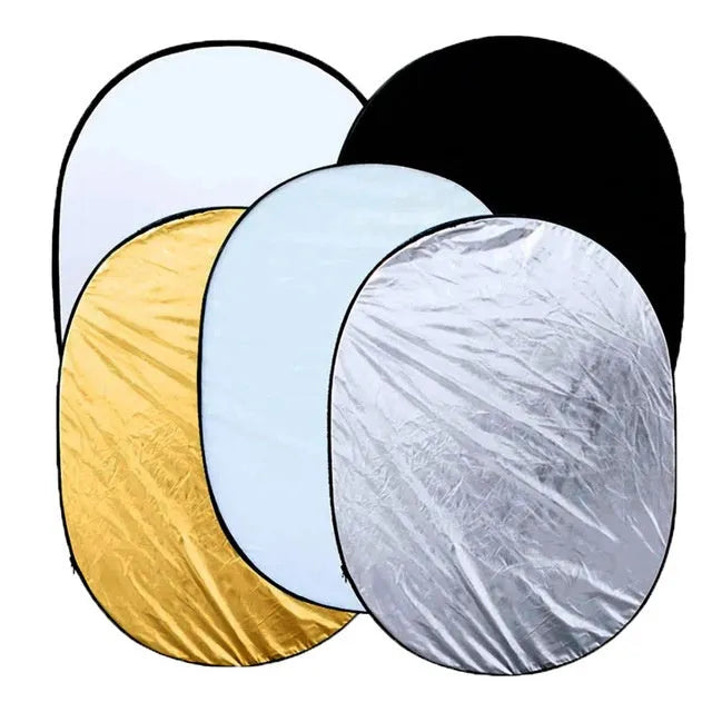 5-in-1 collapsible photography light reflector with gold, silver, white, black, and translucent surfaces.