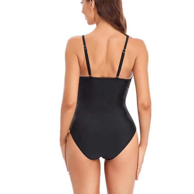 Women's solid blue backless one-piece swimsuit on a mannequin, showing mesh lining and tight fit.