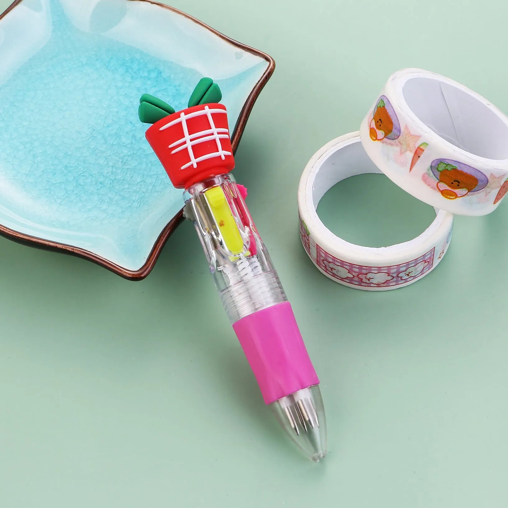 Christmas mini four-colour press-action ballpoint pen with festive designs measuring 11 cm.