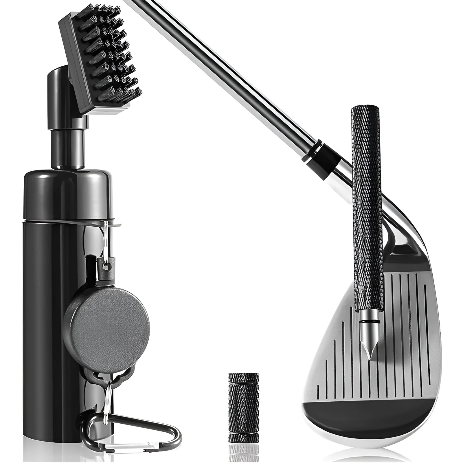 Black plastic golf club groove cleaning tool on a grassy surface with a golf ball nearby