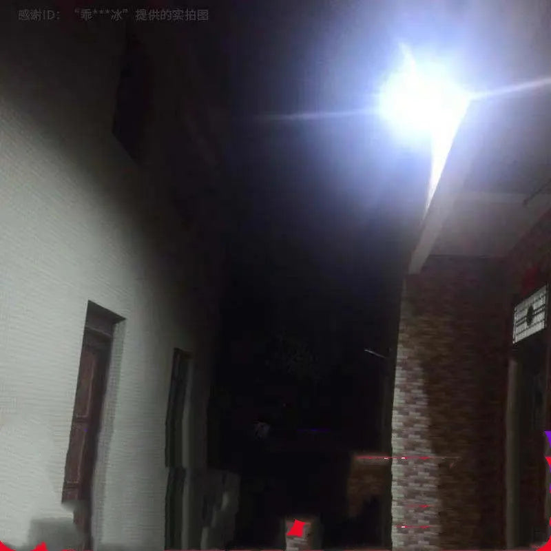 Black solar-powered LED flood light for outdoor garden and street lighting with remote control.