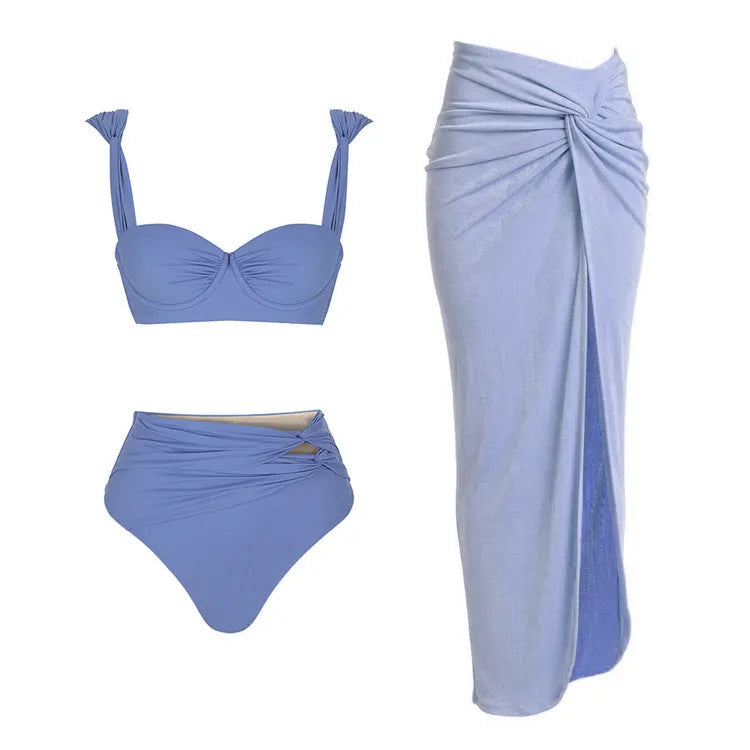 Women's solid-colour one-piece swimsuit with gold buttons and a matching skirt in assorted colours.