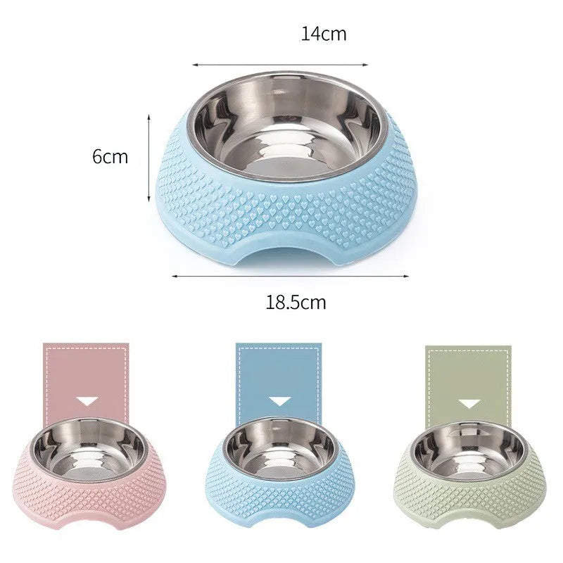 Blue stainless steel pet bowl with a non-slip black base on a kitchen floor.