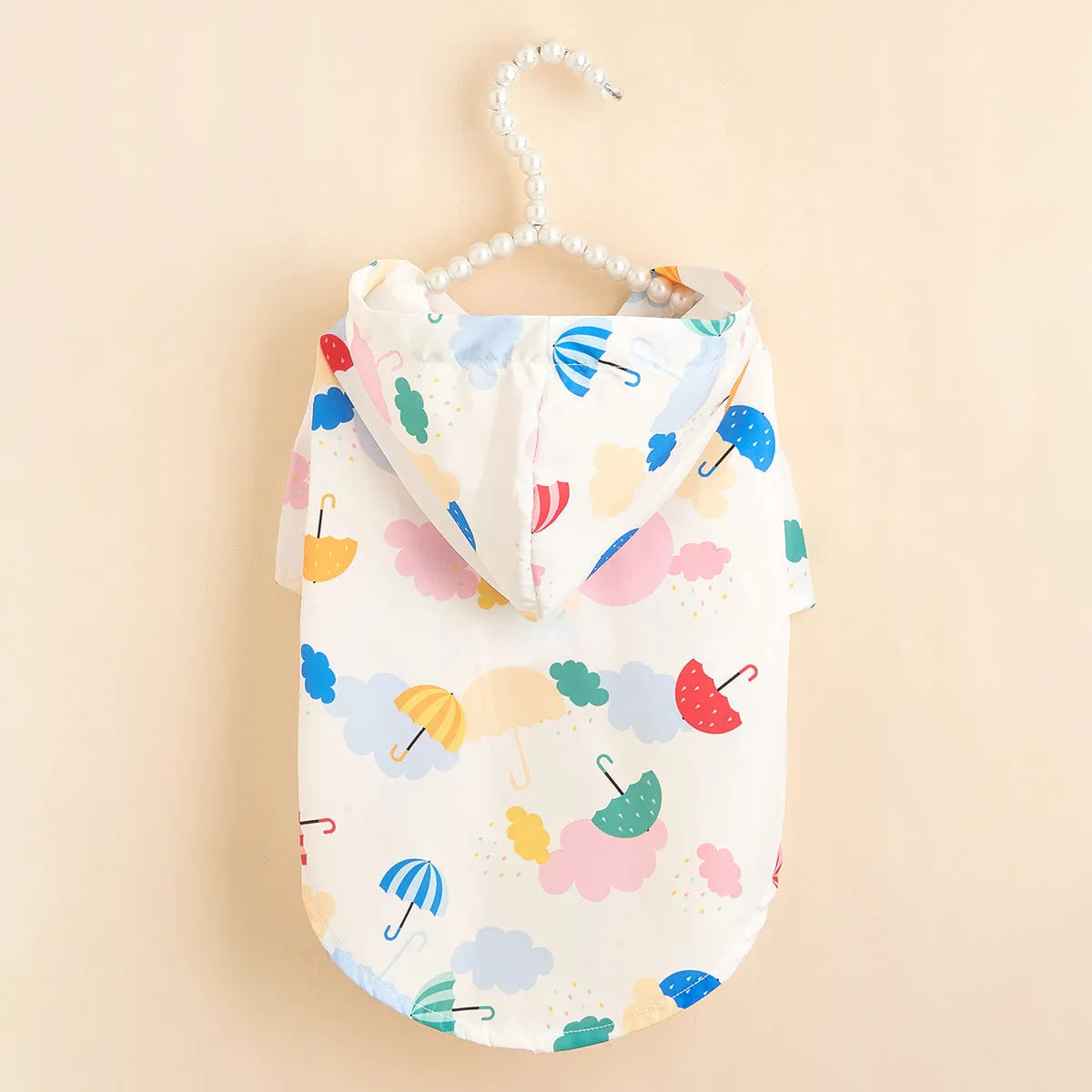 Colourful cartoon umbrella pattern dog raincoat in polyester fabric, size label shown