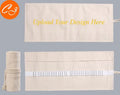 Canvas pencil wrap with multiple elastic bands rolled up showing slot configuration