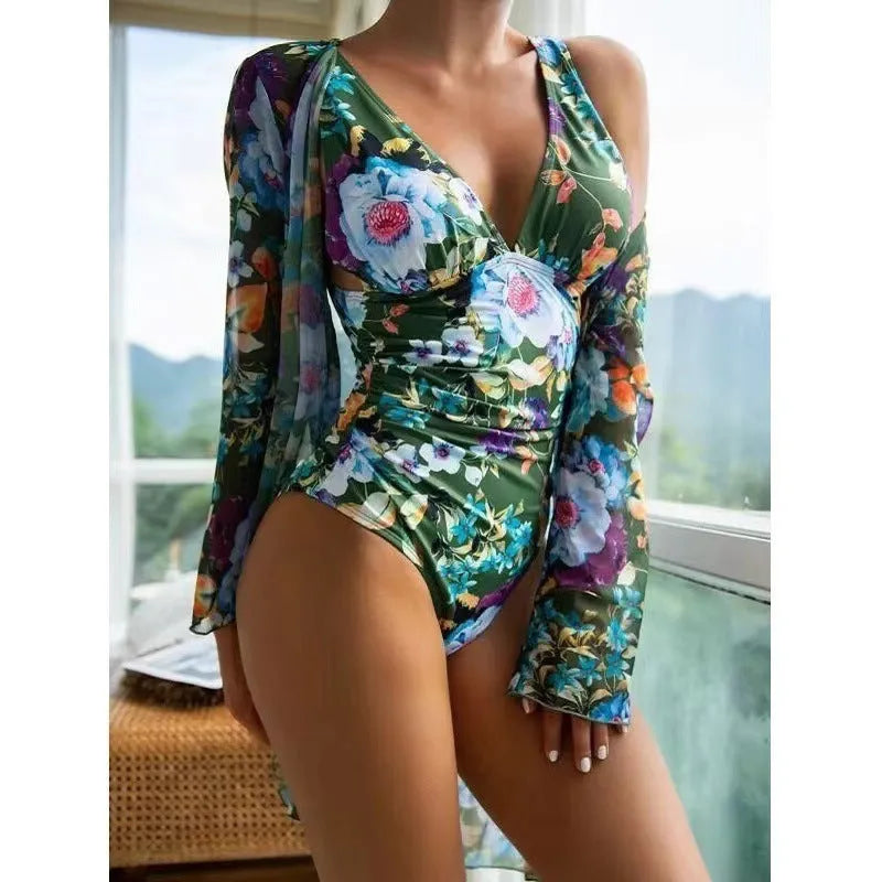 Women's floral patterned tight bikini three-piece swimsuit set with a cover-up coat.