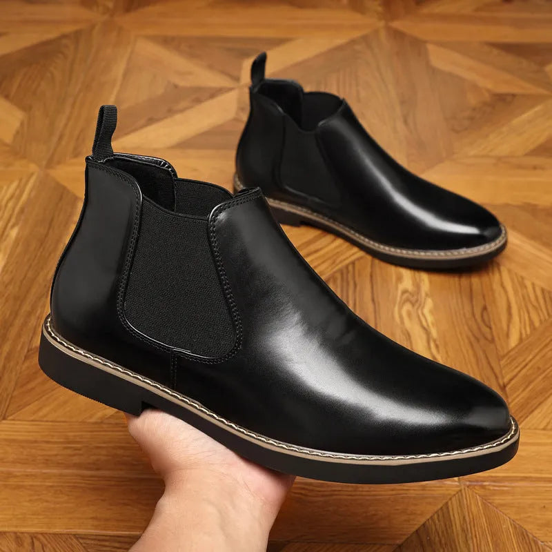 Black and brown formal pointed-toe leather boots with a square heel and rubber sole.