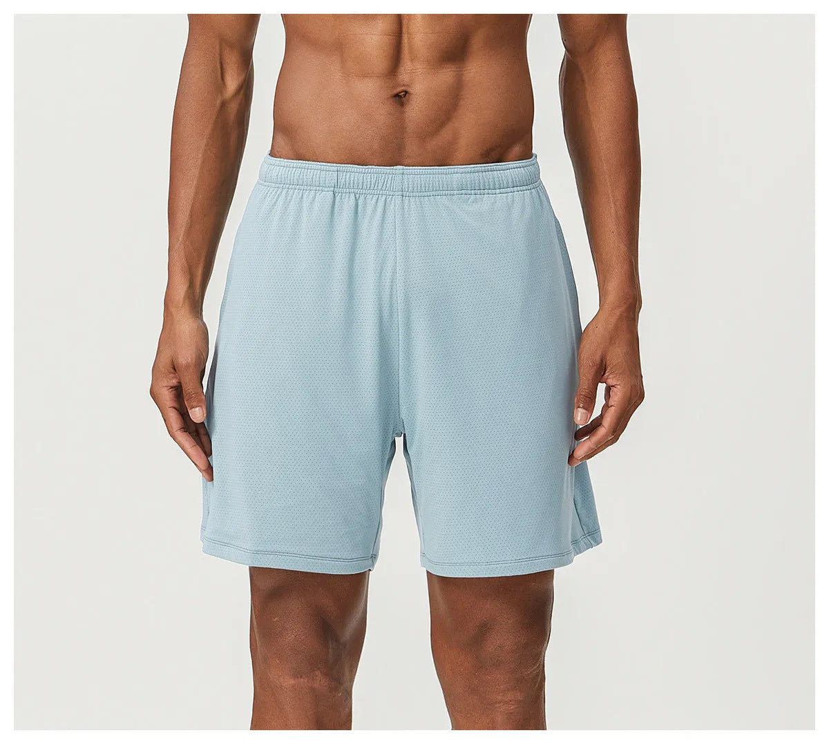Men's sky green quick-drying running shorts with mid-waist design on a plain background.