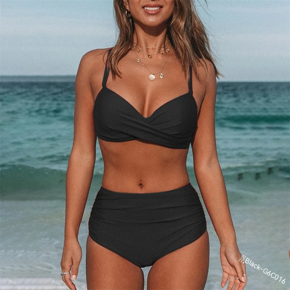 Women's black cross strap bikini swimsuit with briefs bottom on a mannequin.