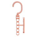 Blue magic revolving wardrobe hanger with five holes and a central handle on a white background.