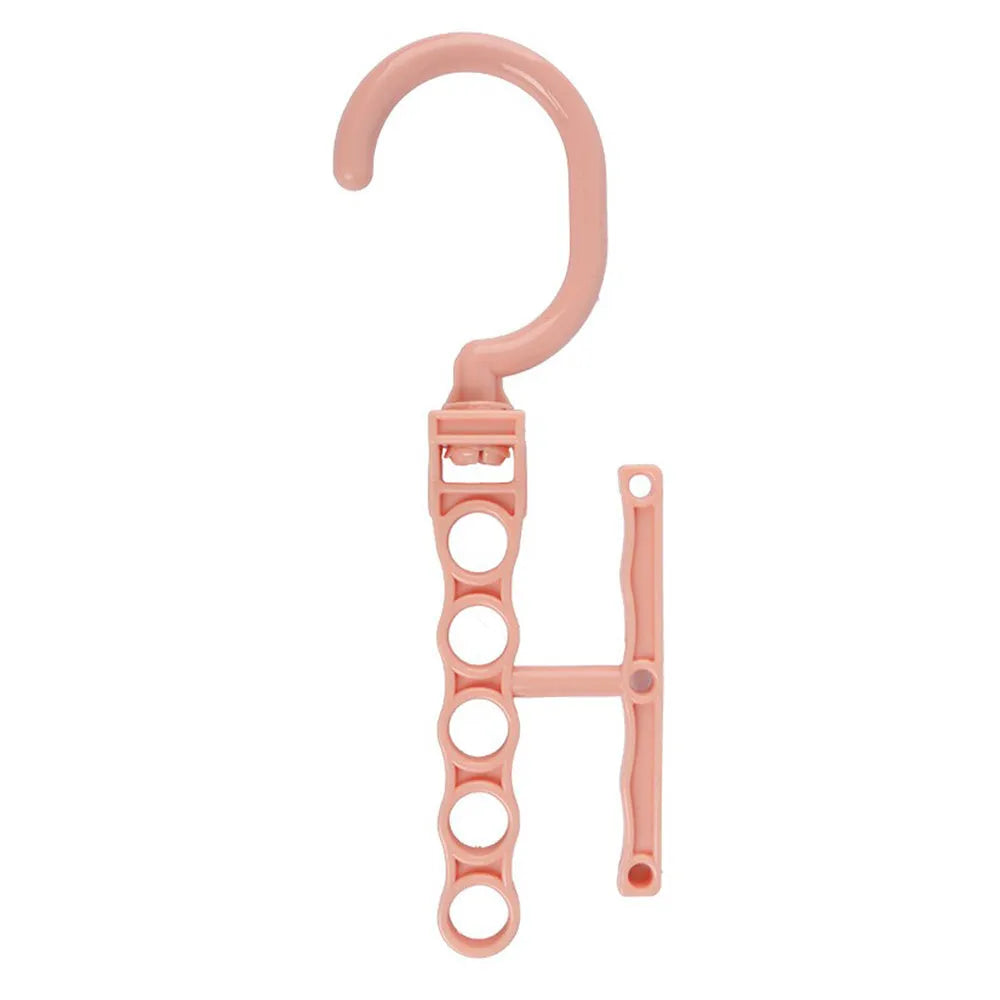 Blue magic revolving wardrobe hanger with five holes and a central handle on a white background.