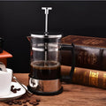 Compact glass and stainless steel manual coffee maker with 350ml capacity