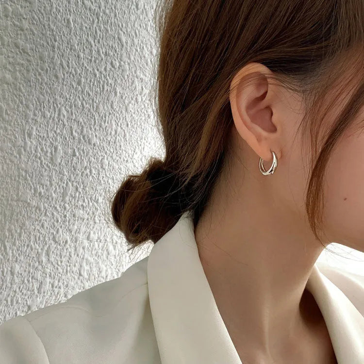 Women's geometric water drop earrings in gold or silver finish, shown in large, medium, and small sizes.