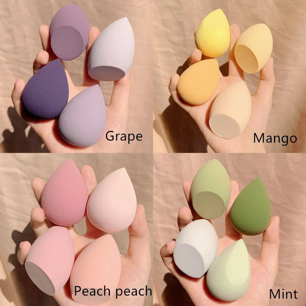 Four 6cm makeup egg sponges in grape, mango, mint and peach colours