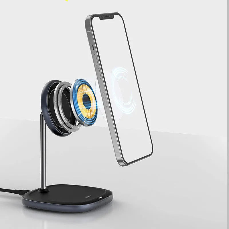 Black Swan magnetic wireless charging stand holding an iPhone 12 upright on a desk