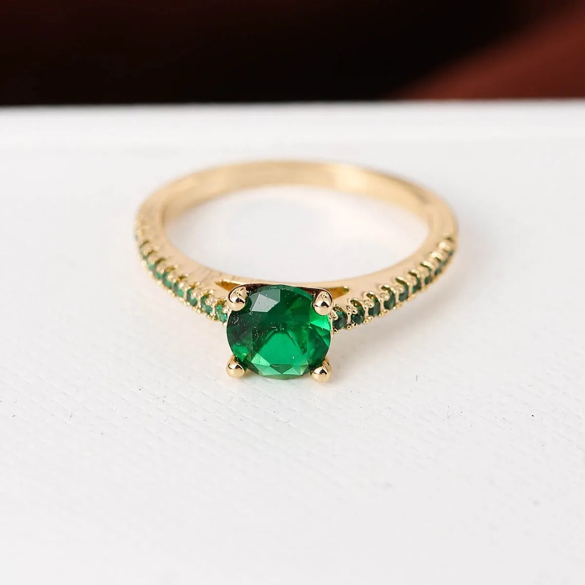 Zircon hexagon ring with geometric design showing electroplated colour options on copper base