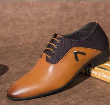 Men's black Oxford shoes with a low upper, brogue detailing, and a rubber sole.