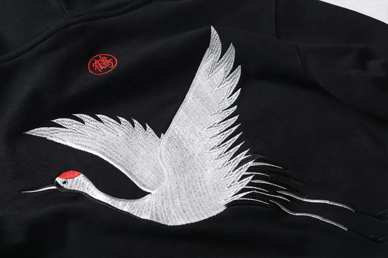 Front view of black cotton hip hop hoodie with embroidered detailing, size M