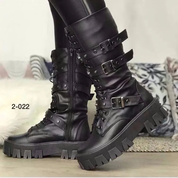 Women's black mid-calf boots with metal buckle straps and a side zipper on a white background.