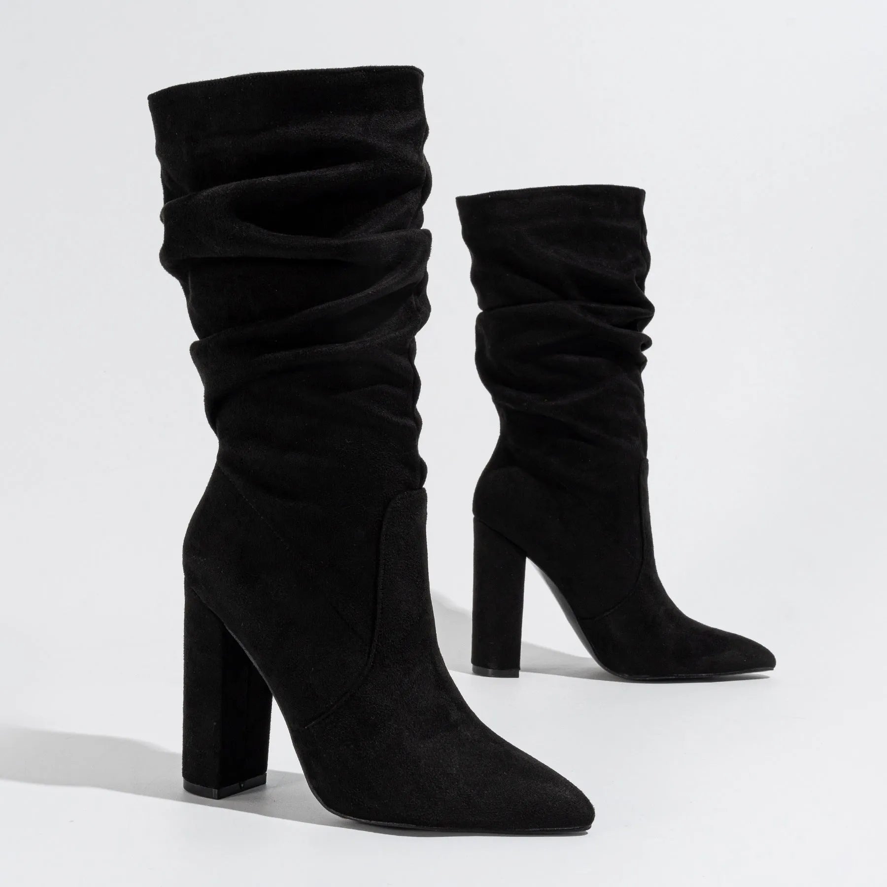 Women's black suede chunky heel pointed-toe boots with mid-calf length and oversleeves design
