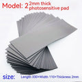 Black and gray plastic light-sensitive mat for seal pottery and calligraphy, showing 330mm by 110mm sheet.