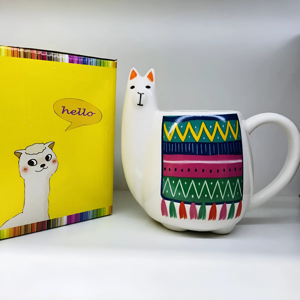 White ceramic mug with handle featuring a cartoon alpaca pattern on the side