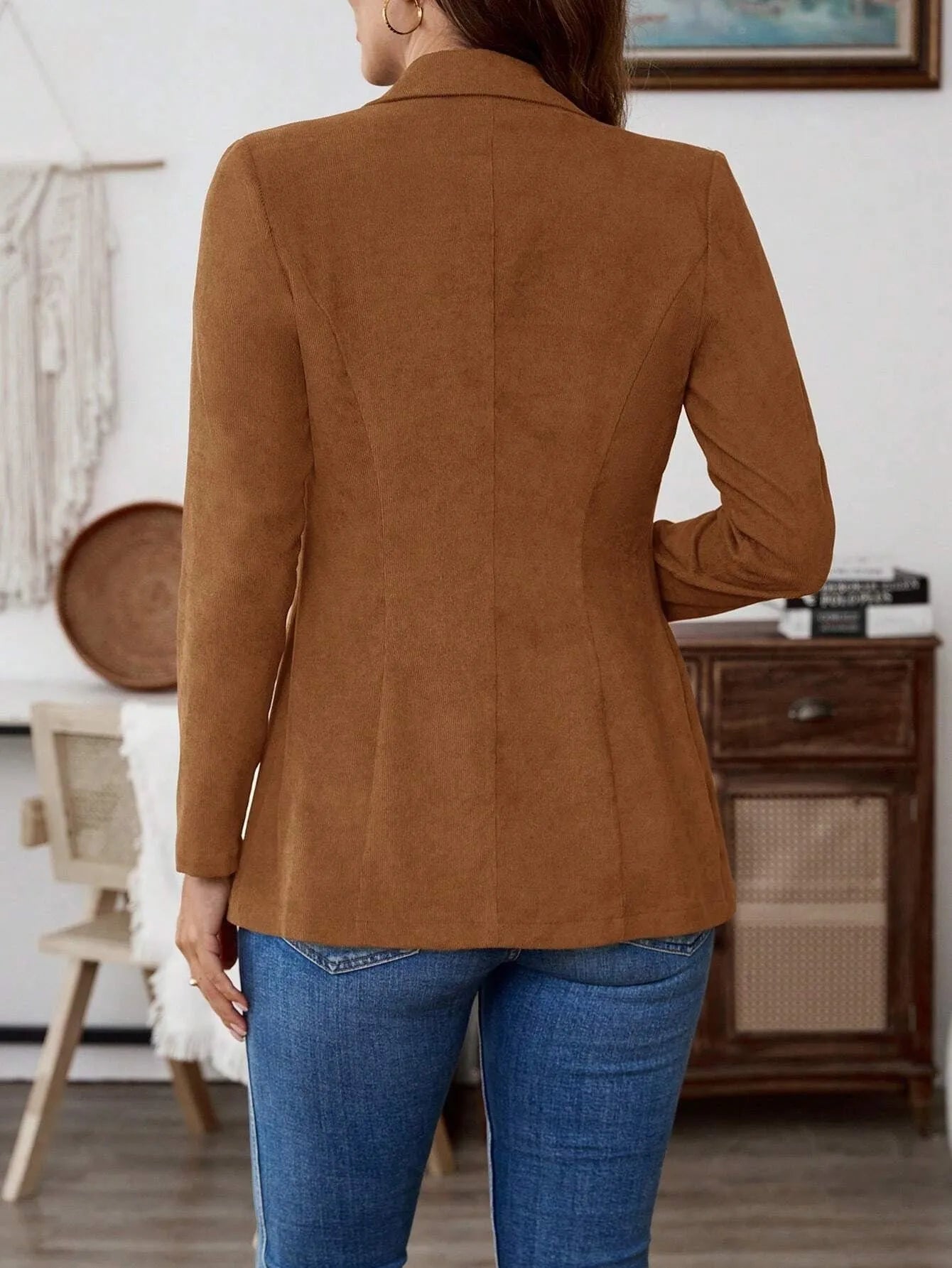 Brown men's single-breasted lapel blazer jacket on a hanger