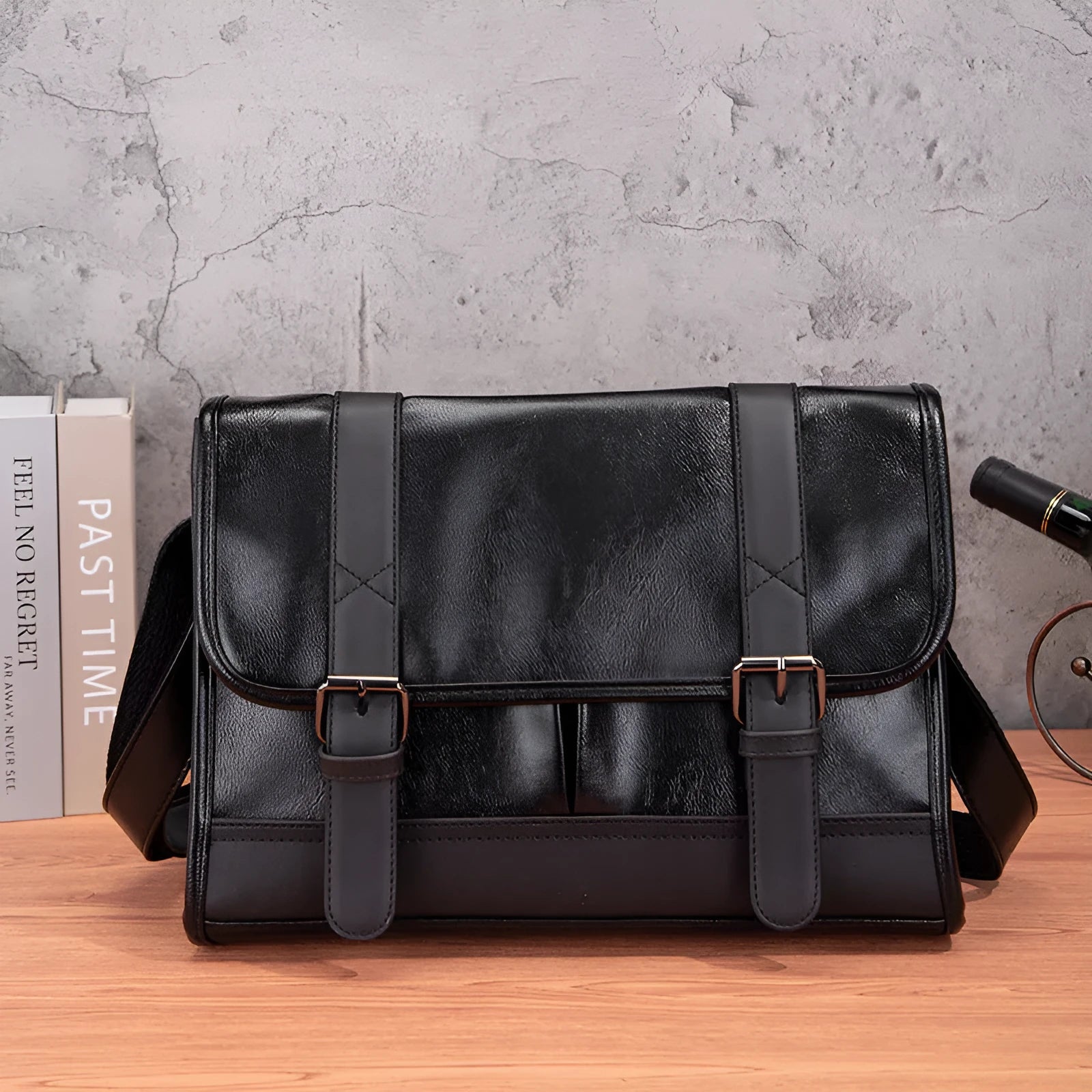 Black polyurethane commuter backpack with contrast stitching and anti-theft features