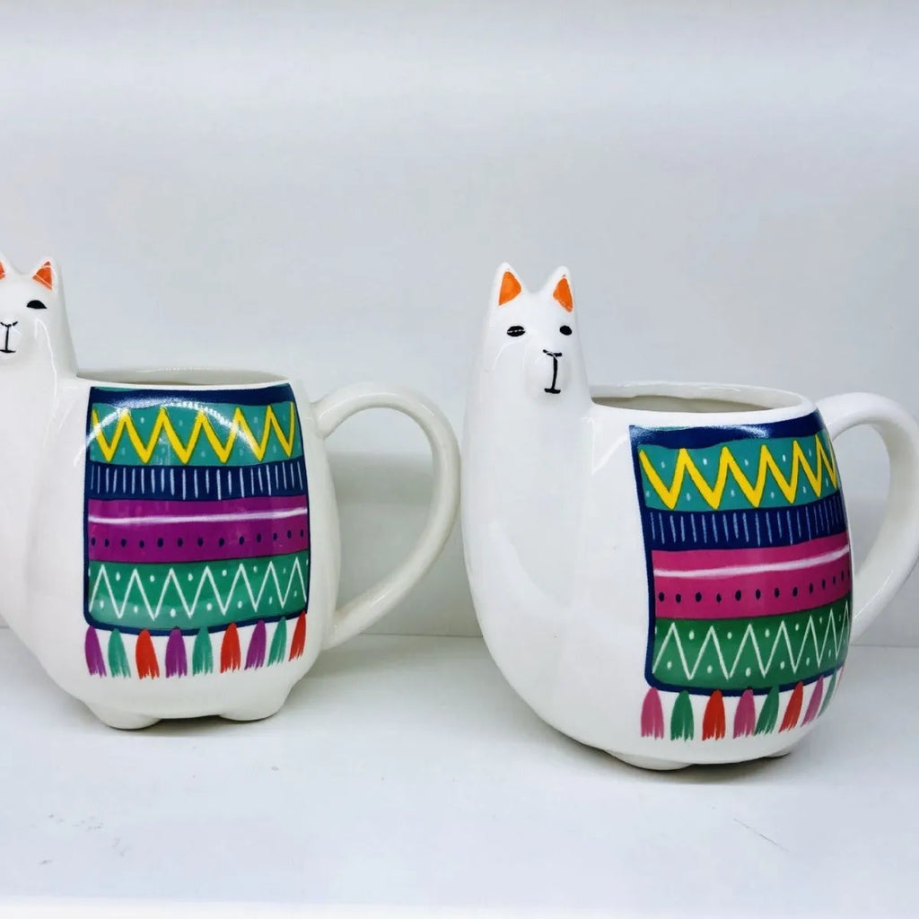 White ceramic mug with handle featuring a cartoon alpaca pattern on the side