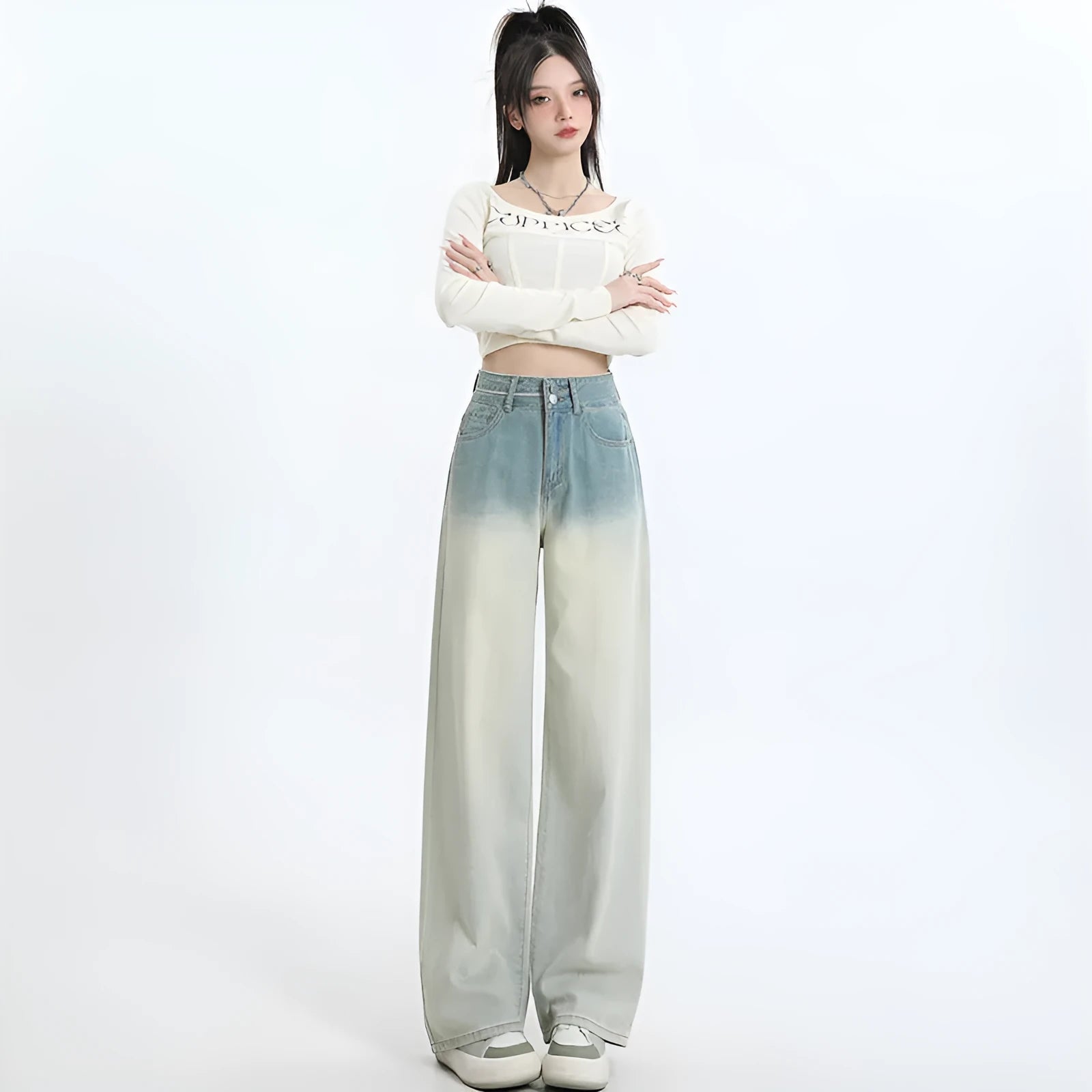 Women's gradient blue denim straight-leg trousers with wide-leg styling on size chart background