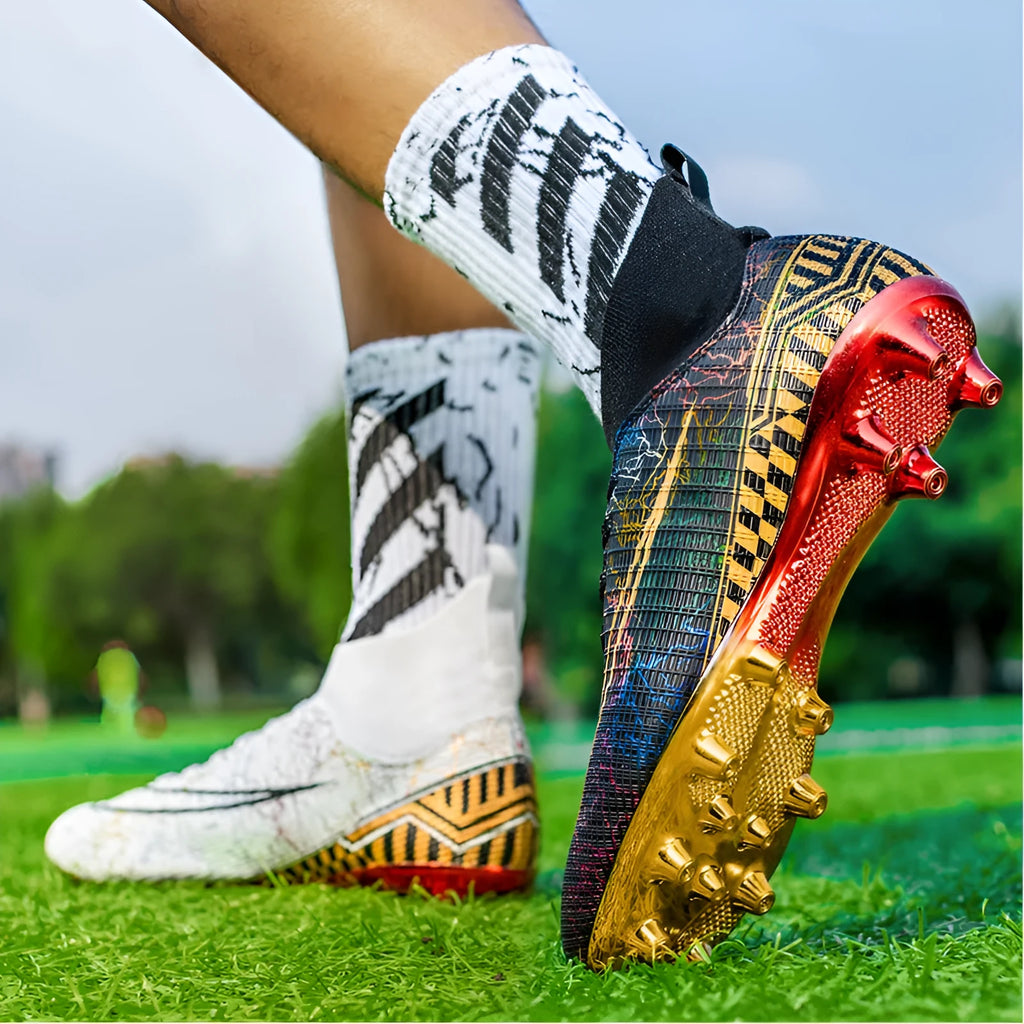 Men's high-top football training shoes with a gold plated bottom on a synthetic leather and PVC sole.