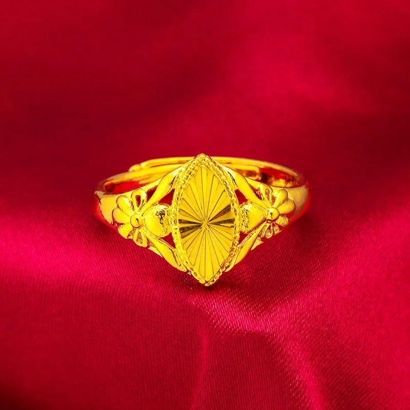 Gold electroplated open flower ring with geometric texture on adjustable brass band