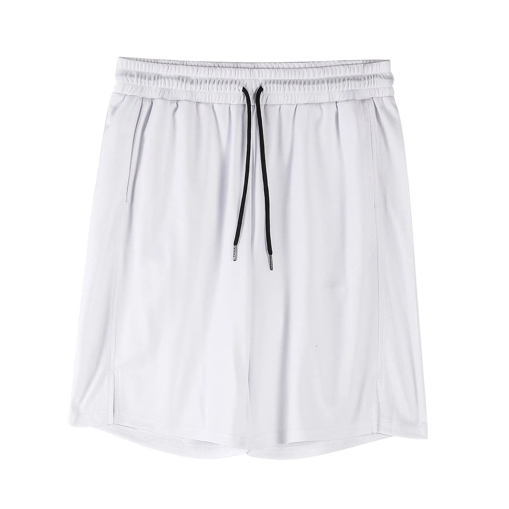 Man wearing loose-fitting black quick-dry mesh shorts with an elasticated waist.