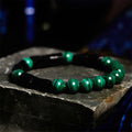 Natural obsidian stone bracelet with constellation design on 8mm beads.