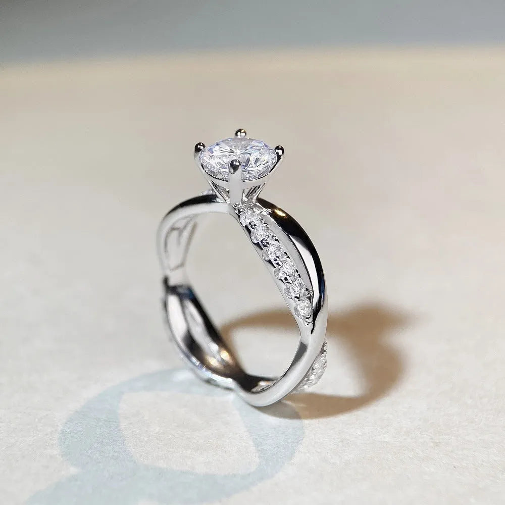 White Diamond 1 karat moissanite ring with twisted Sterling Silver band and four-claw setting.