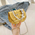Silver PU leather women's crossbody bag with a horizontal square shape and single shoulder strap.