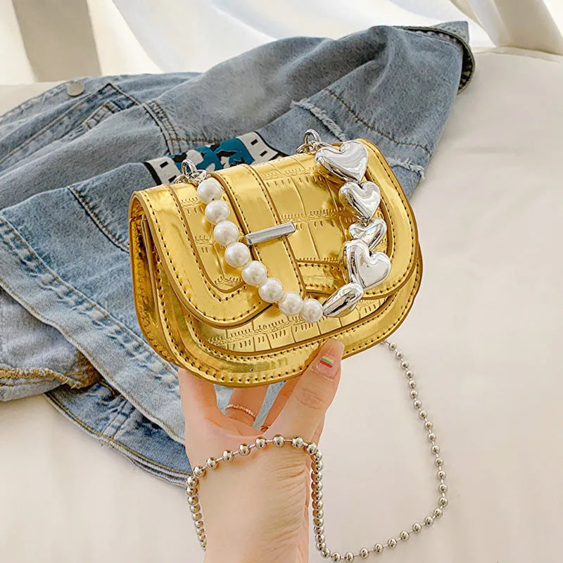 Silver PU leather women's crossbody bag with a horizontal square shape and single shoulder strap.