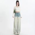 Women's gradient blue denim straight-leg trousers with wide-leg styling on size chart background