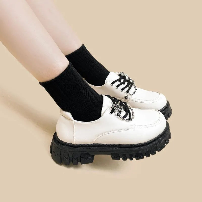 Women's Duke Asterism colour loafers with a cross strap and metal buckle on a round toe.