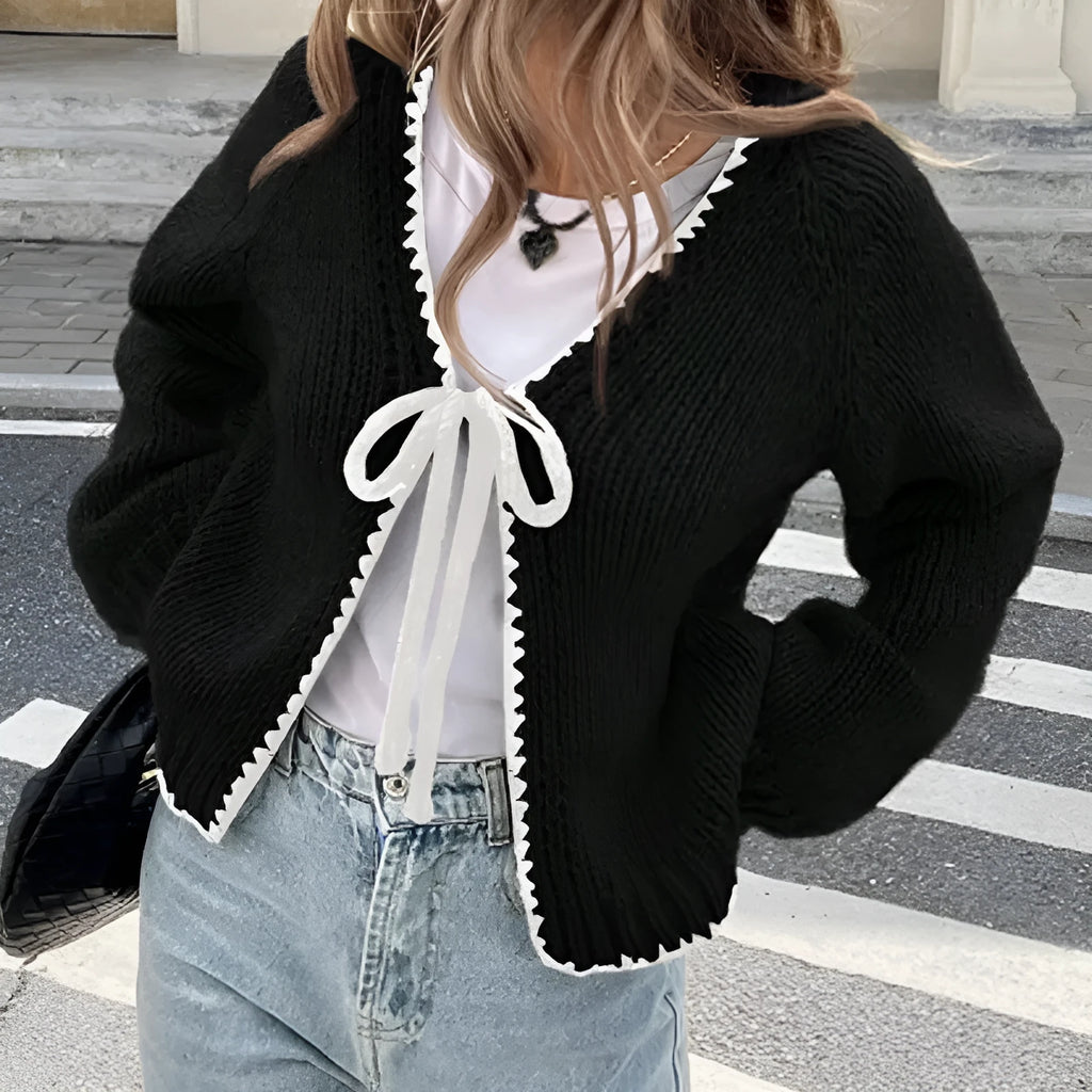 Women's gray loose-fit cardigan with long sleeves and white crochet flower details on the front.