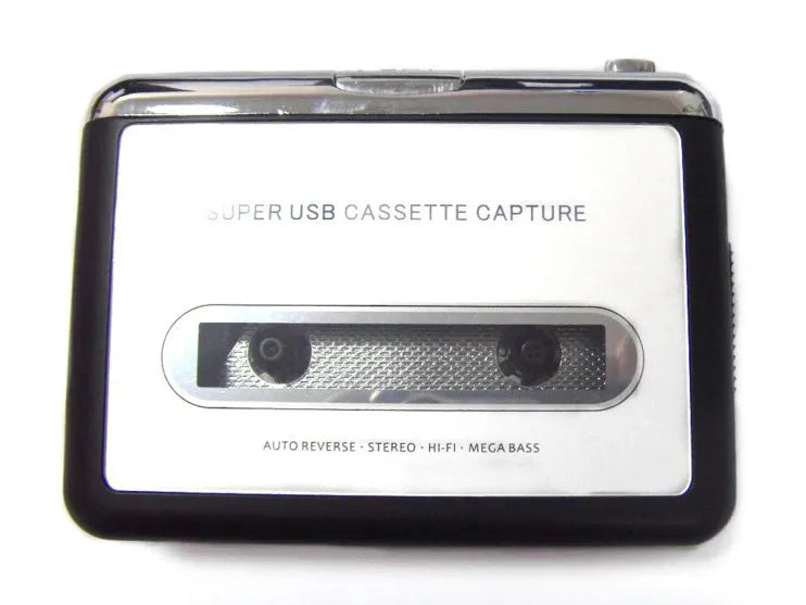Compact black cassette to MP3 converter with USB cable on a desk next to a cassette tape.