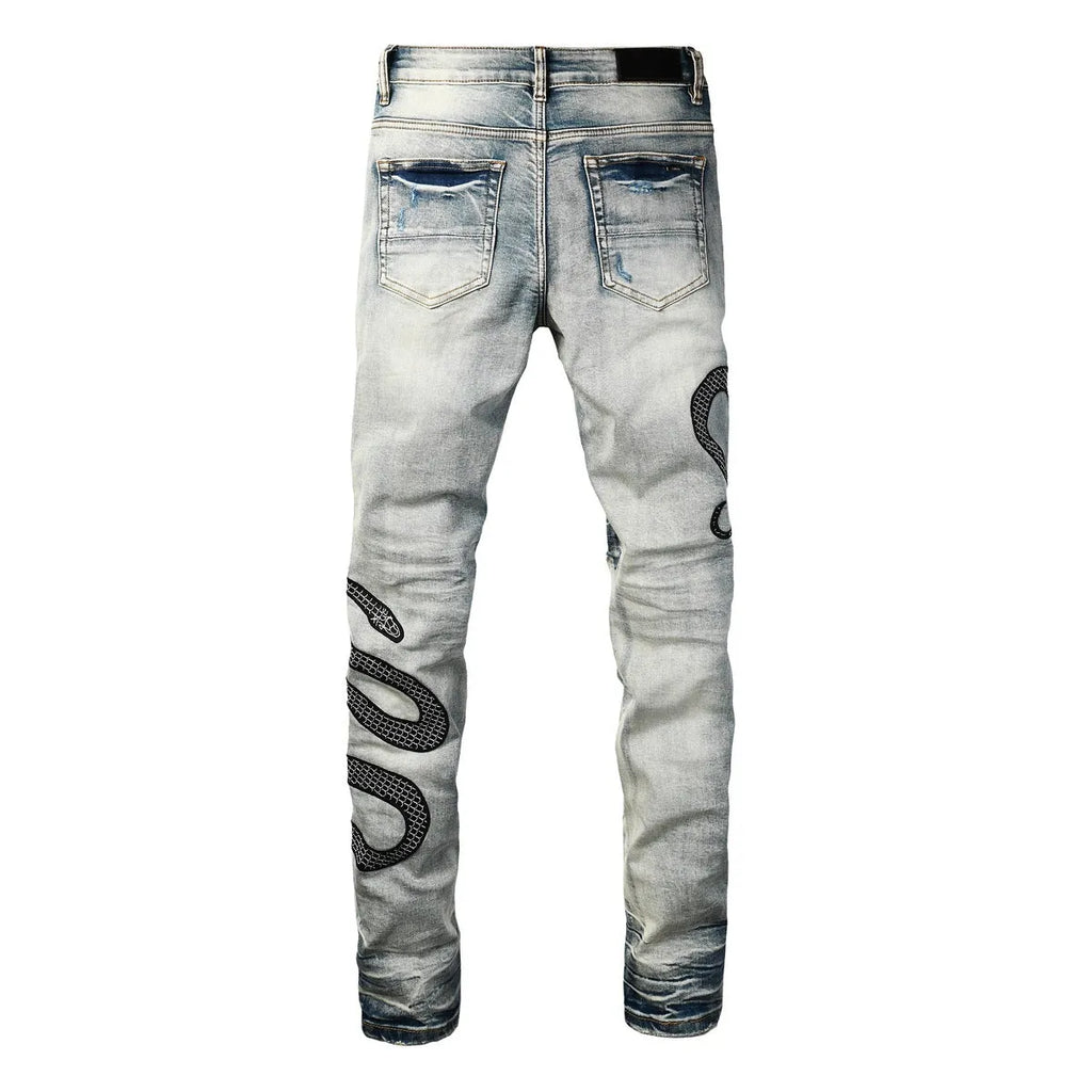 Blue distressed street fashion skinny jeans with a button fly and mid-rise waist on a hanger.